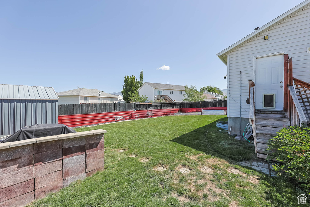View of yard featuring entry steps