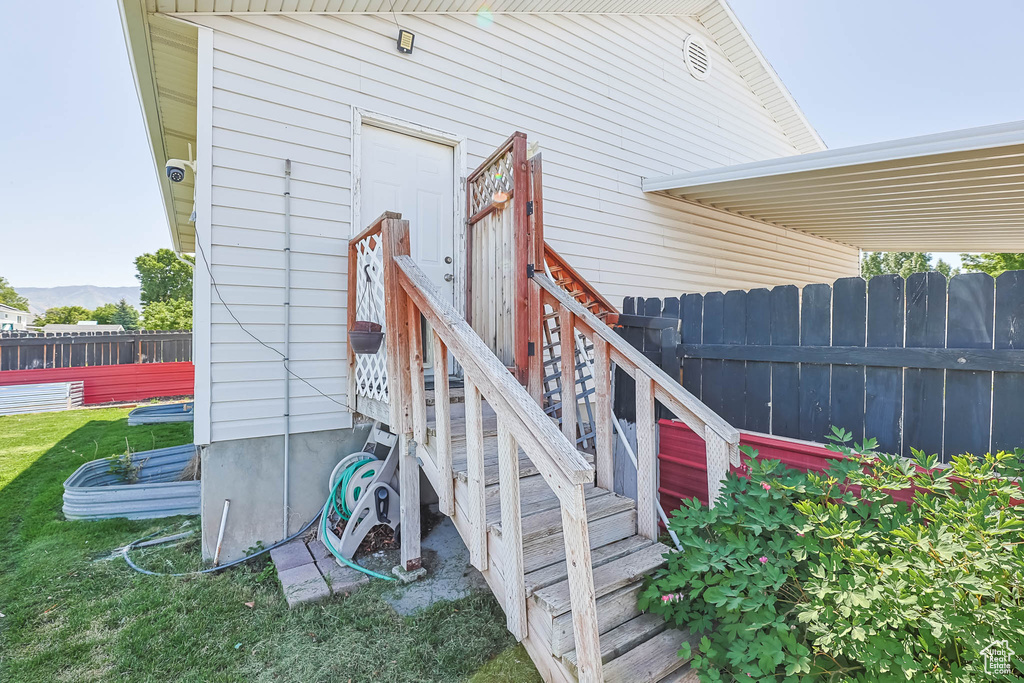 Entrance to property featuring a security system