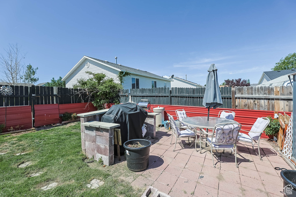 View of patio with outdoor dining area