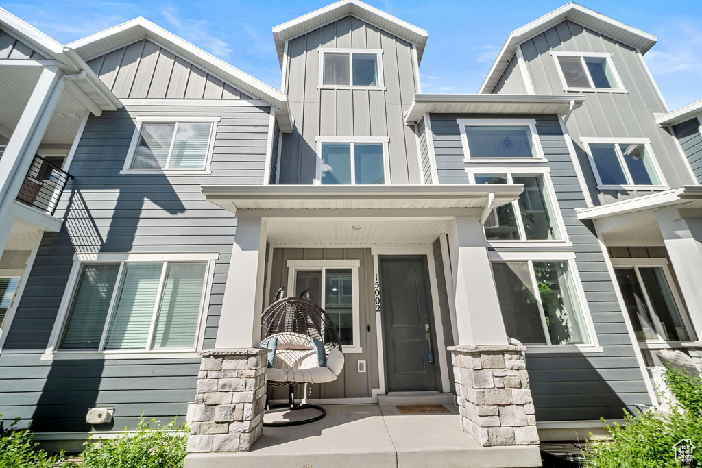 View of front of house with board and batten siding