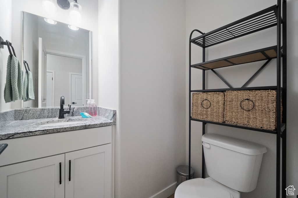 Bathroom with toilet and vanity