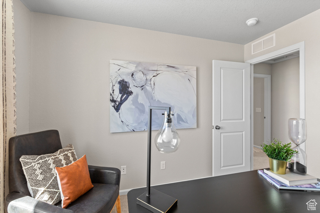 Sitting room featuring baseboards
