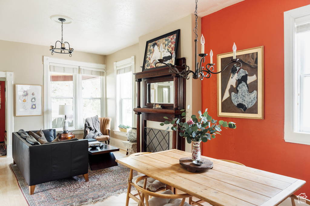 Dining room with a chandelier and wood finished floors