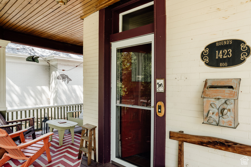 Property entrance with covered porch