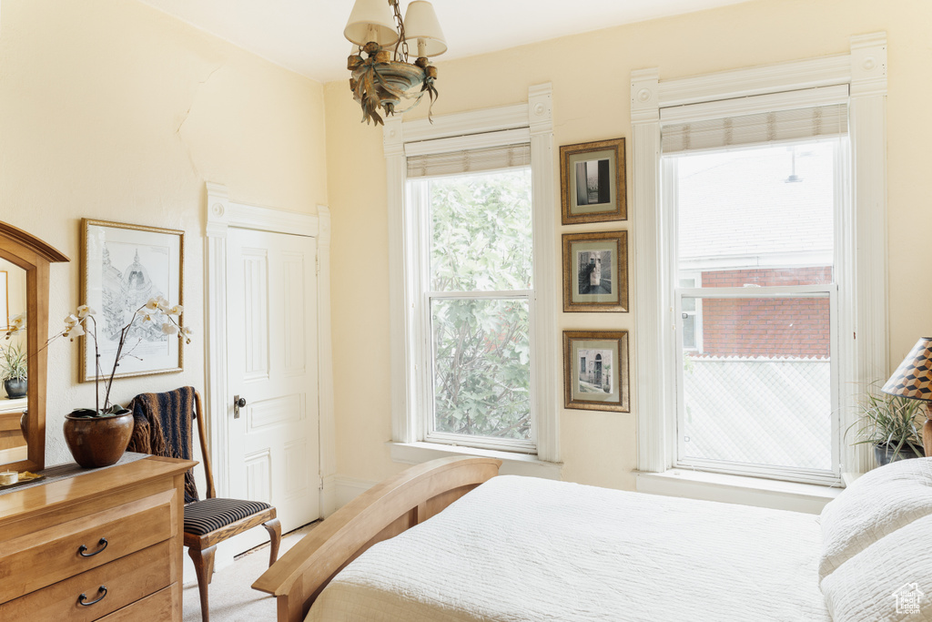 Bedroom featuring a chandelier