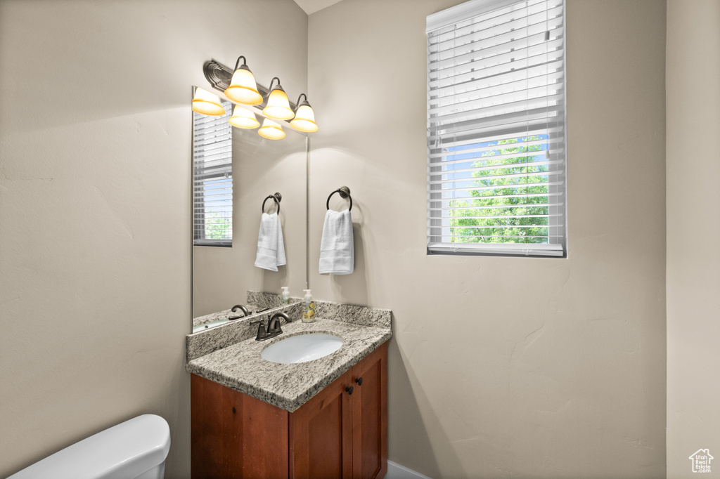 Bathroom featuring vanity and toilet