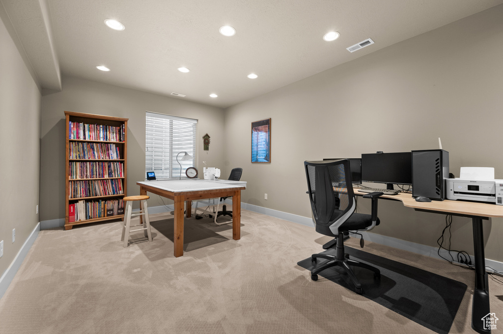 Home office featuring recessed lighting, light carpet, and baseboards