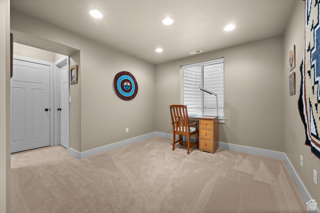 Office space with light colored carpet, recessed lighting, and baseboards