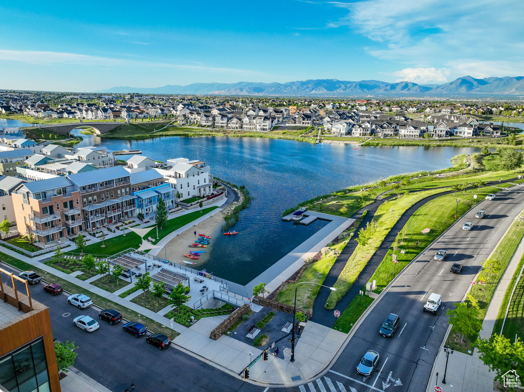 Aerial perspective of suburban area with a water and mountain view