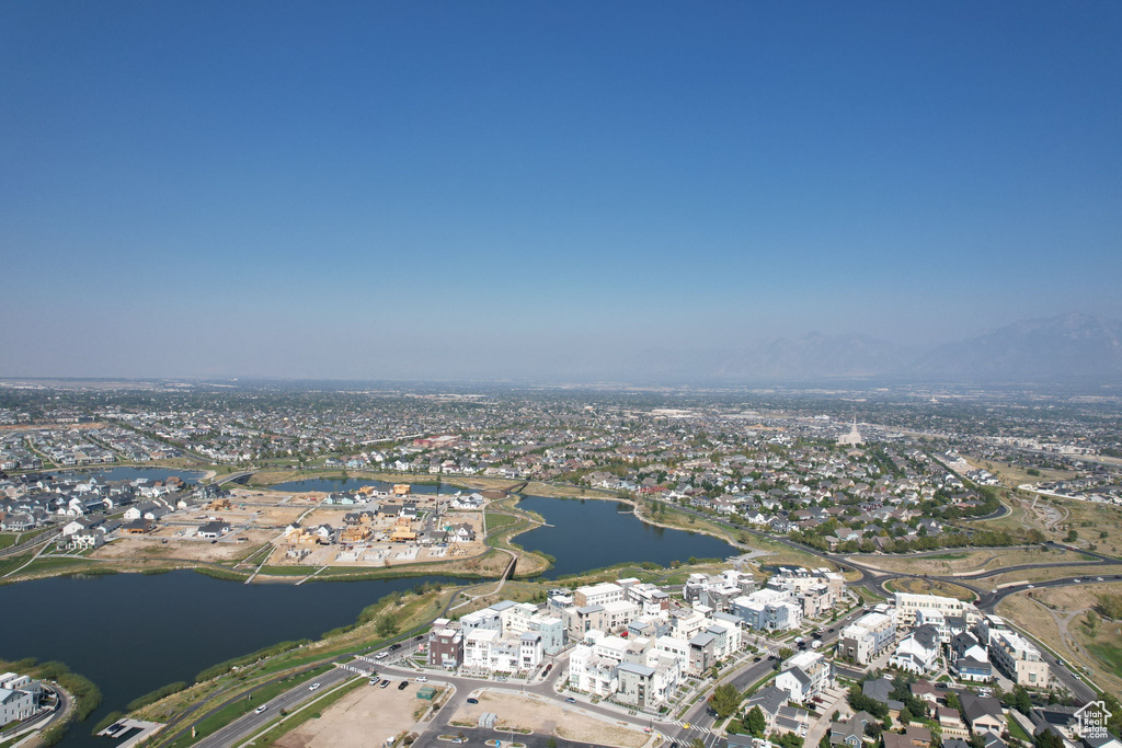 Aerial overview of property\'s location with a nearby body of water