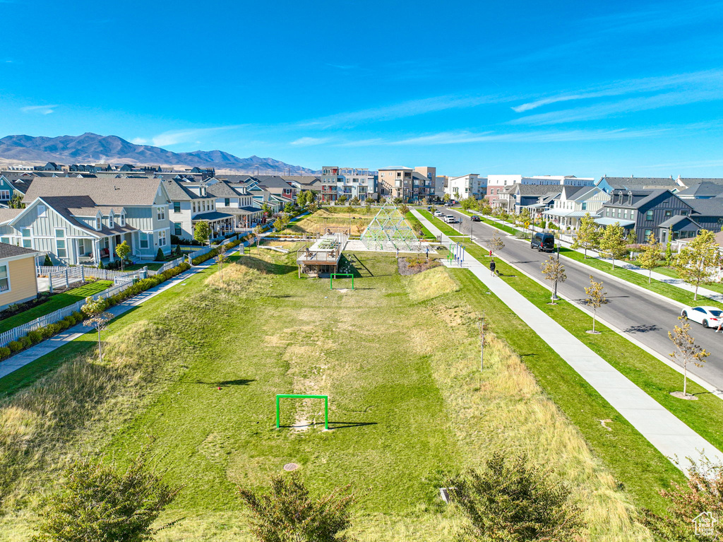 Aerial perspective of suburban area featuring a mountain backdrop
