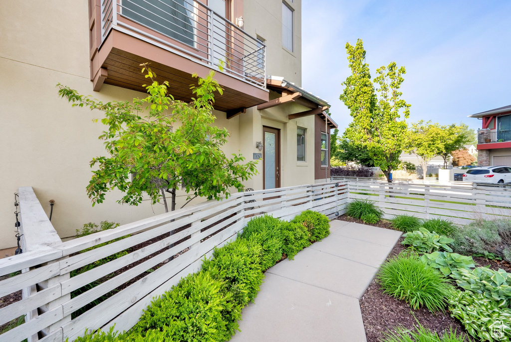 Entrance to property with stucco siding