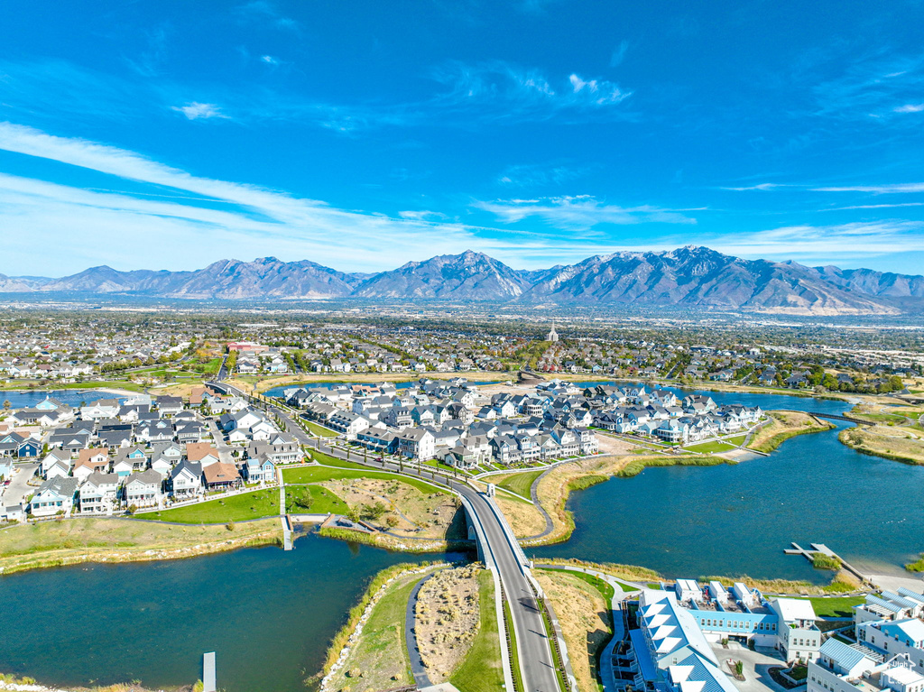 Aerial view of residential area featuring a water and mountain view