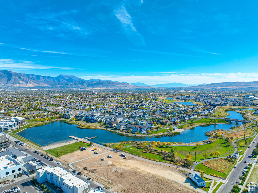 Aerial perspective of suburban area featuring a water and mountain view