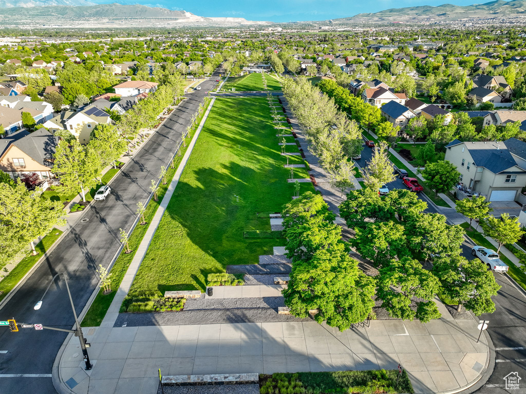 Aerial perspective of suburban area featuring a mountain backdrop