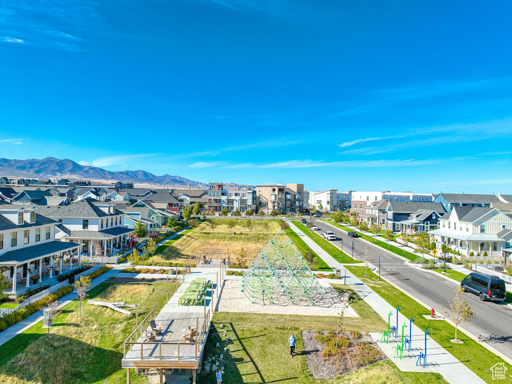 Aerial view of residential area featuring a mountain backdrop