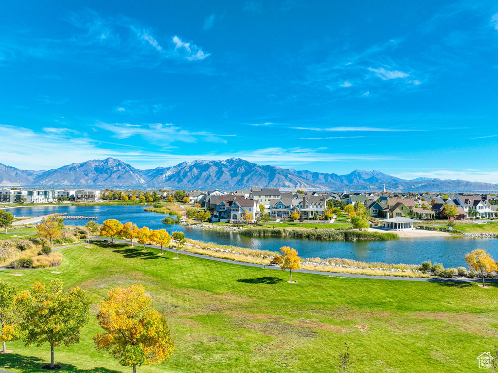 View of mountain background with nearby suburban area and a large body of water