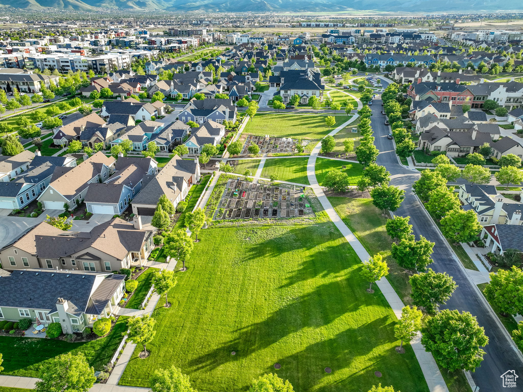 Aerial overview of property\'s location featuring a mountainous background and nearby suburban area