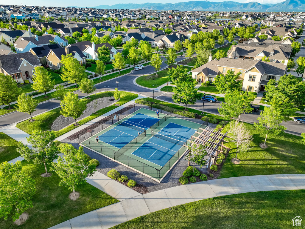 Aerial perspective of suburban area with a mountain backdrop