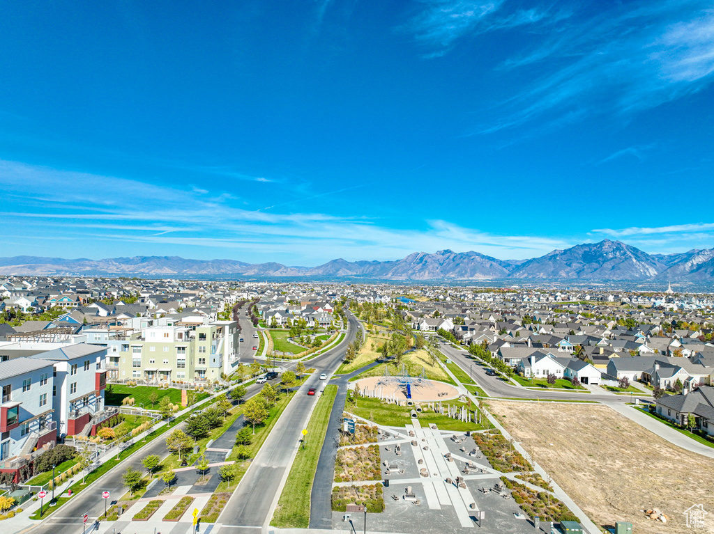 Aerial view of residential area featuring a mountainous background