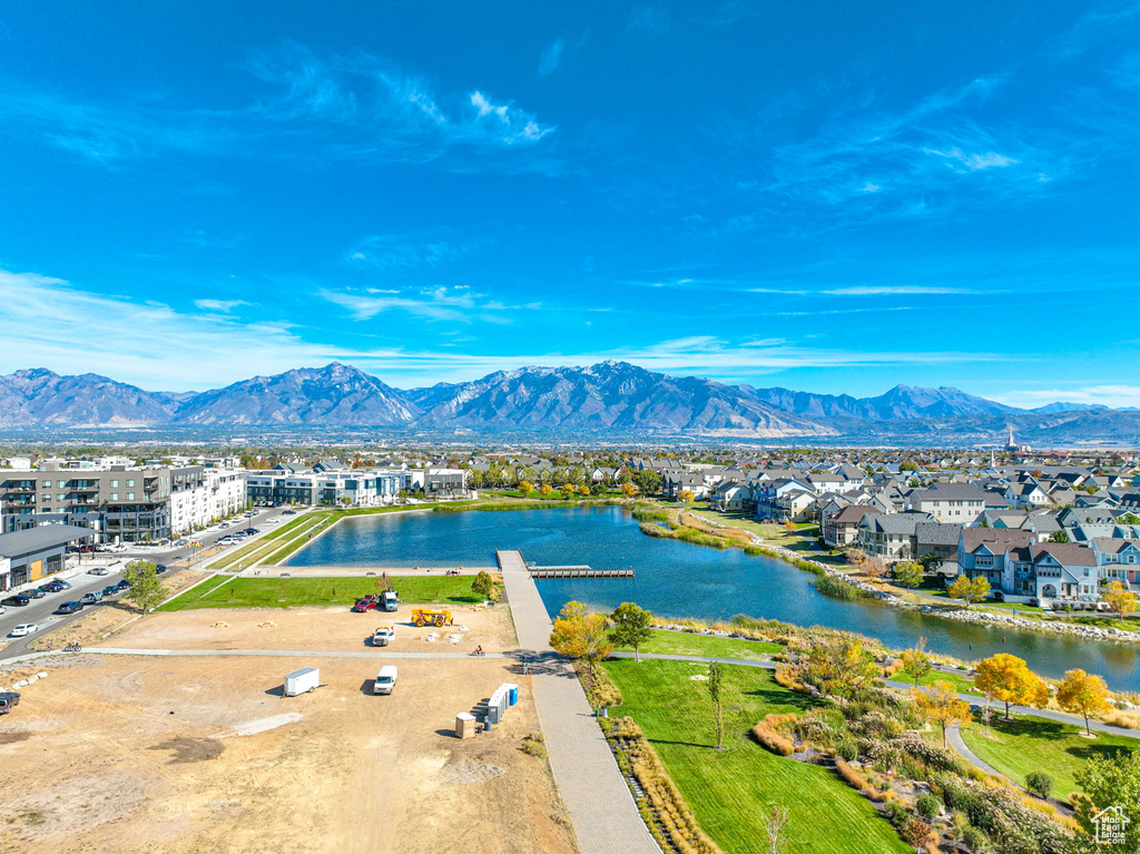 Aerial view of residential area featuring a water and mountain view