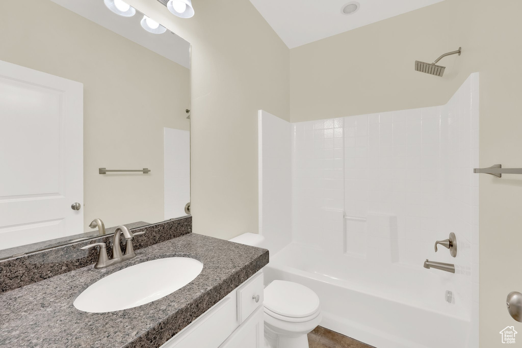 Full bathroom with vanity, toilet, and shower / washtub combination