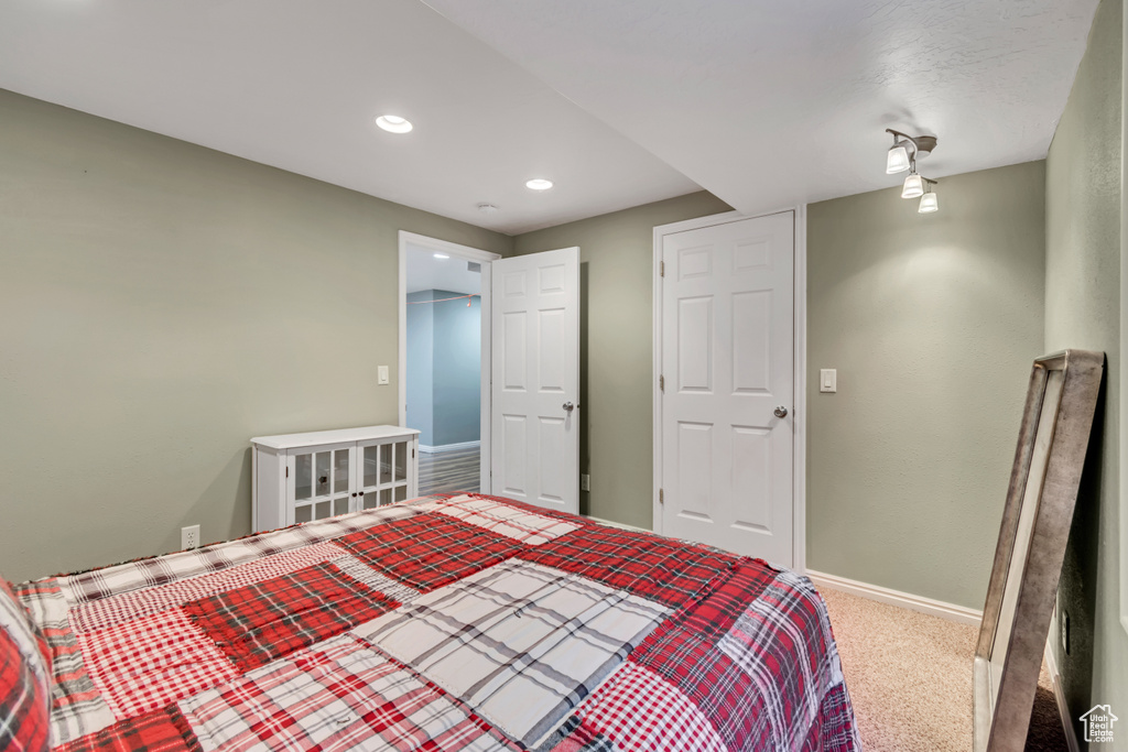 Bedroom with carpet, baseboards, and recessed lighting