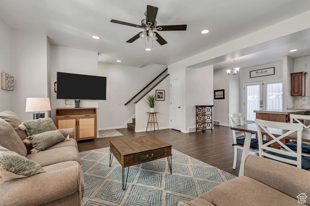 Living area with stairs, dark wood-style floors, ceiling fan, baseboards, and recessed lighting