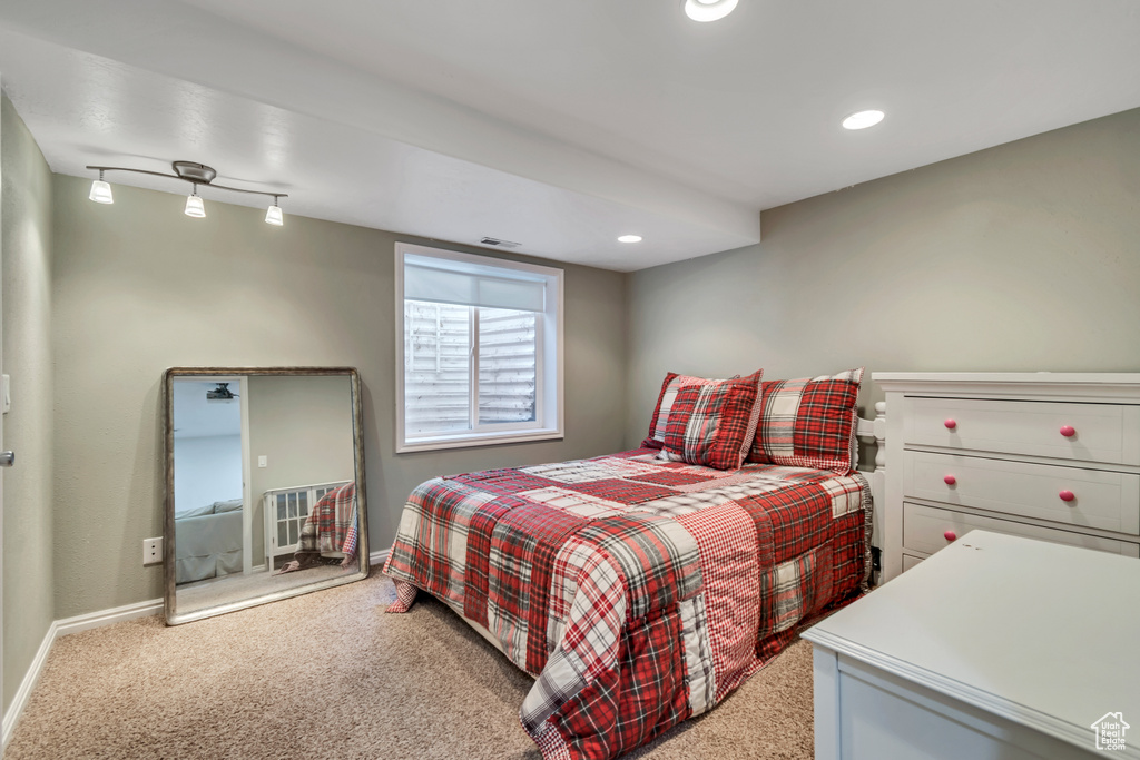 Carpeted bedroom with baseboards