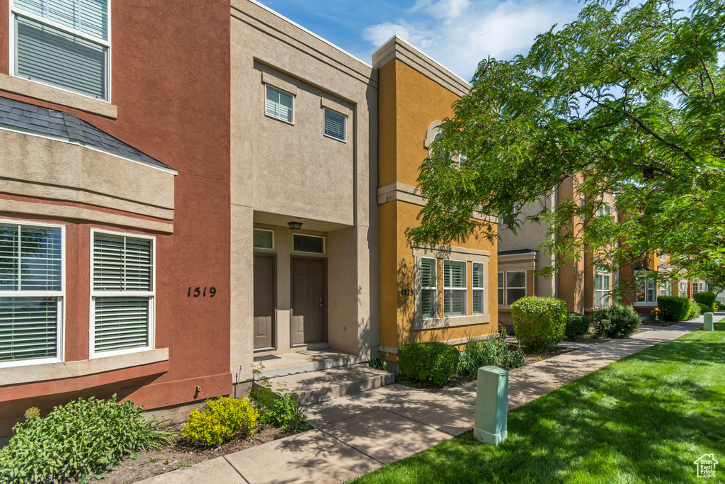 View of front of property featuring stucco siding