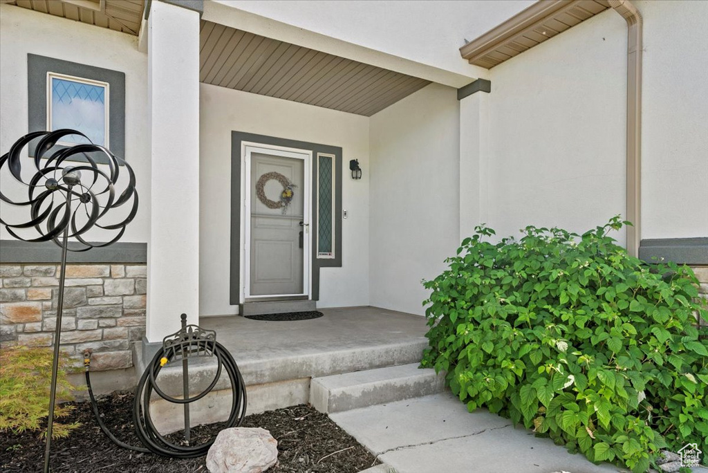 Property entrance featuring stucco siding