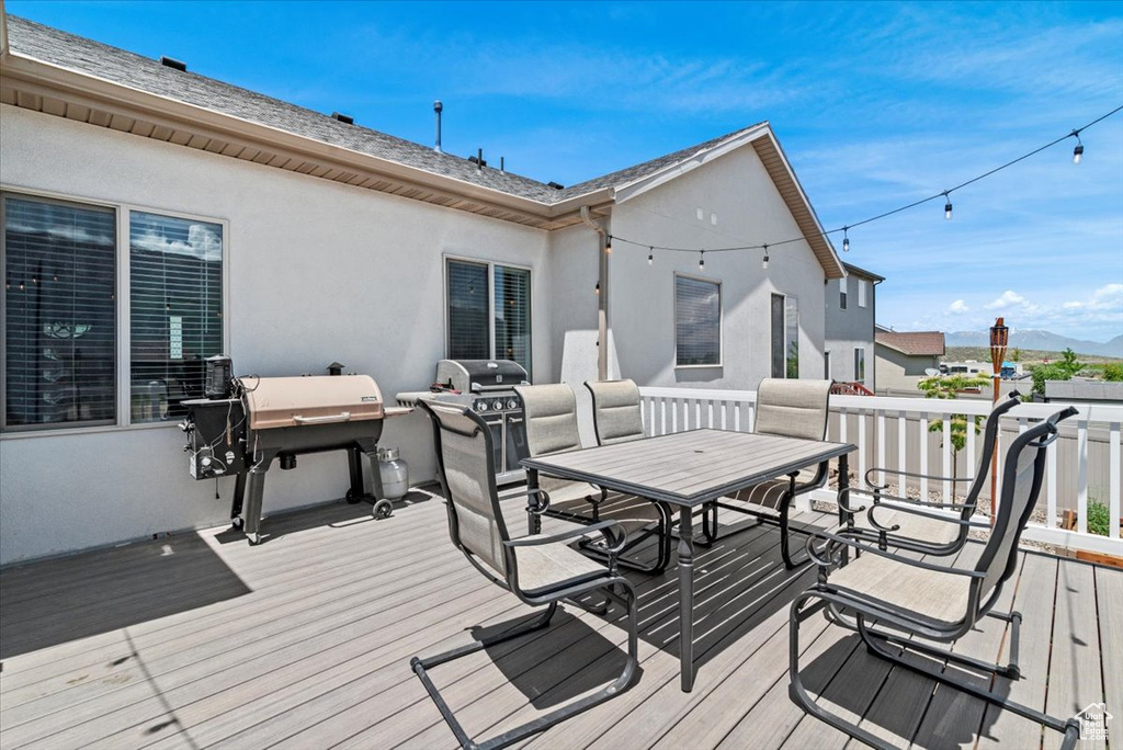 Deck with area for grilling and outdoor dining area