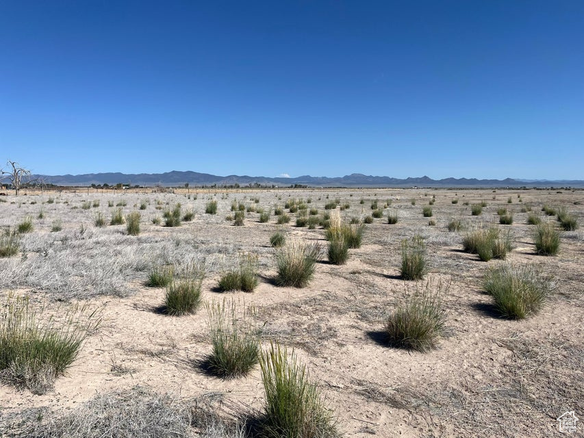 View of mountain backdrop with a desert landscape and rural landscape