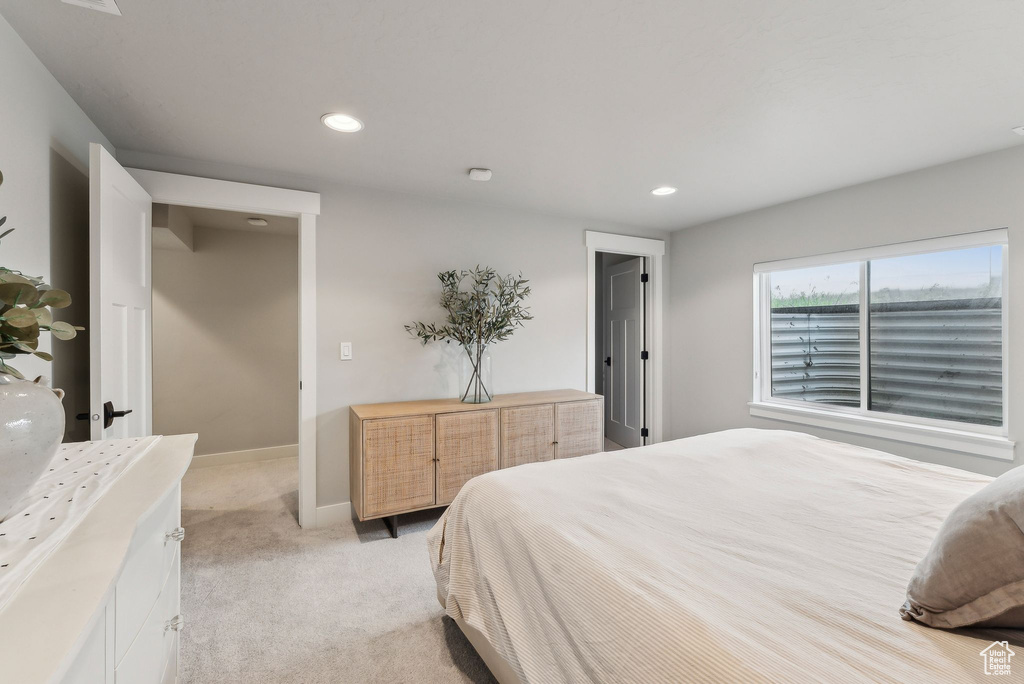 Bedroom featuring recessed lighting, light colored carpet, and baseboards