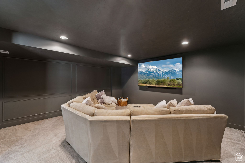 Home theater room featuring light colored carpet and recessed lighting