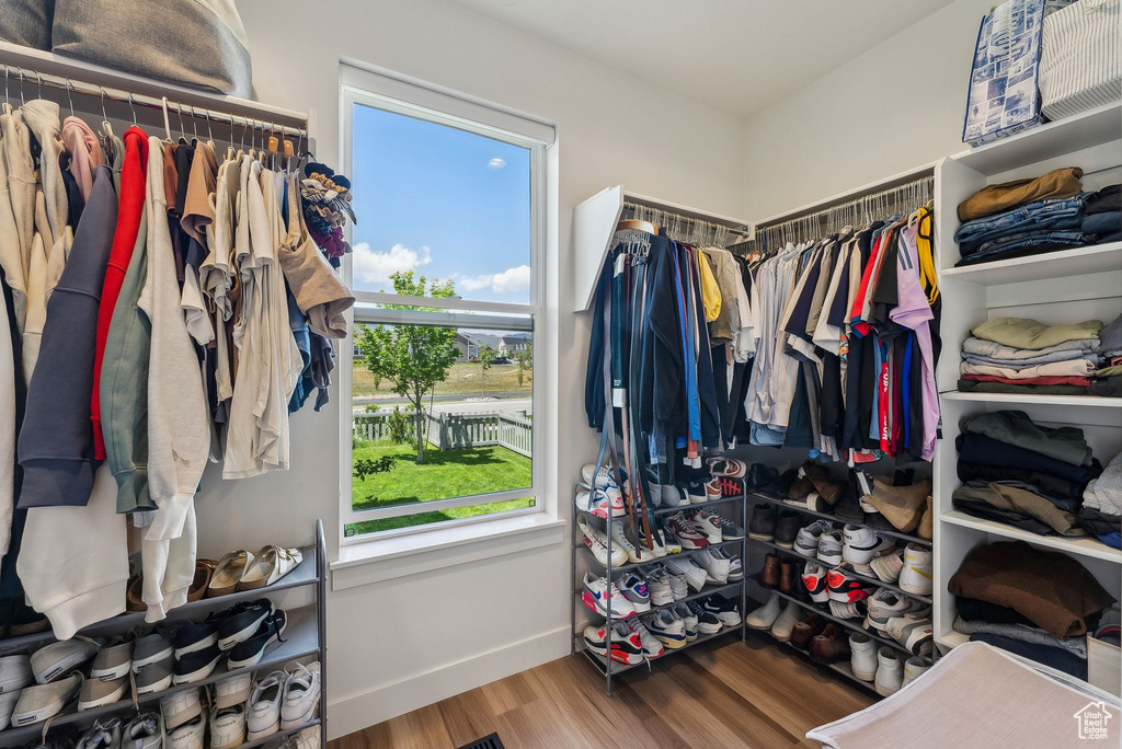 Spacious closet with wood finished floors