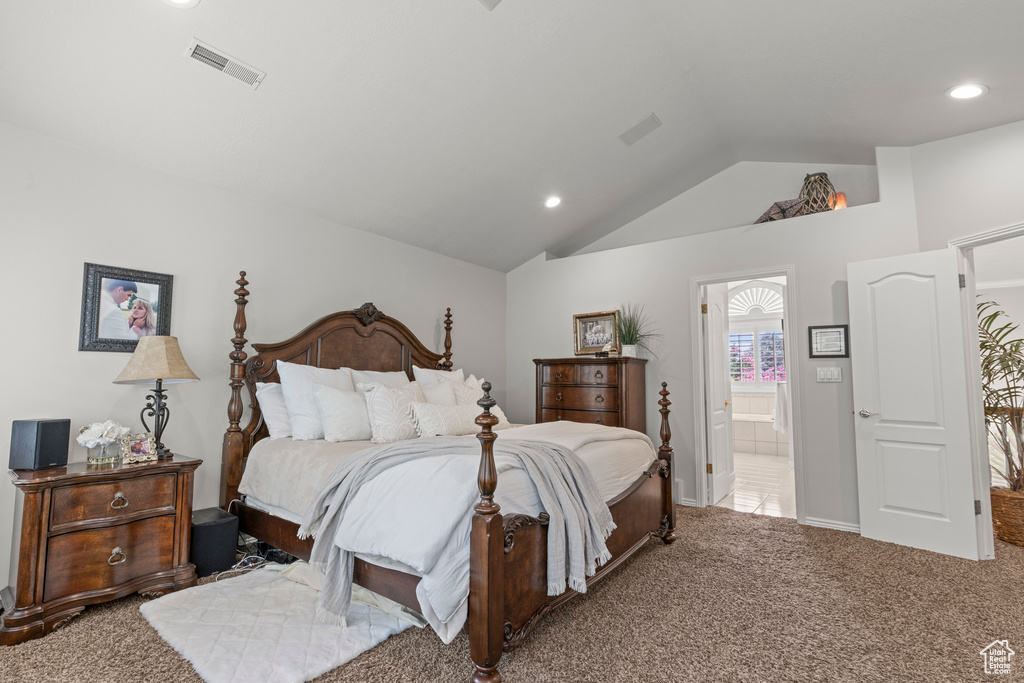 Bedroom featuring vaulted ceiling, carpet floors, ensuite bathroom, and recessed lighting