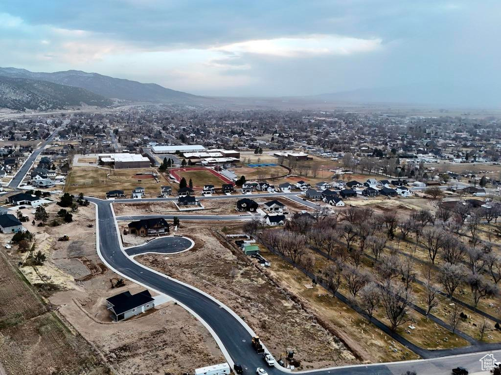 Aerial overview of property's location with a mountainous background