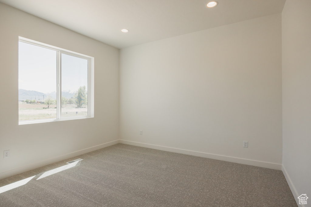 Unfurnished room with carpet flooring, recessed lighting, and baseboards