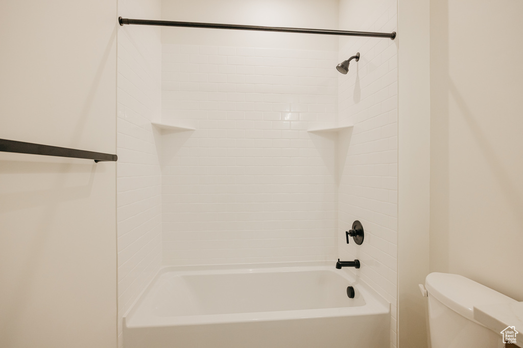Full bathroom with toilet and shower / tub combination