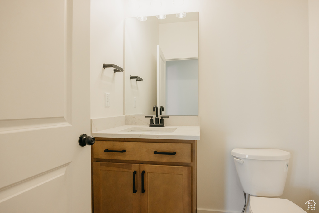 Bathroom with toilet and vanity