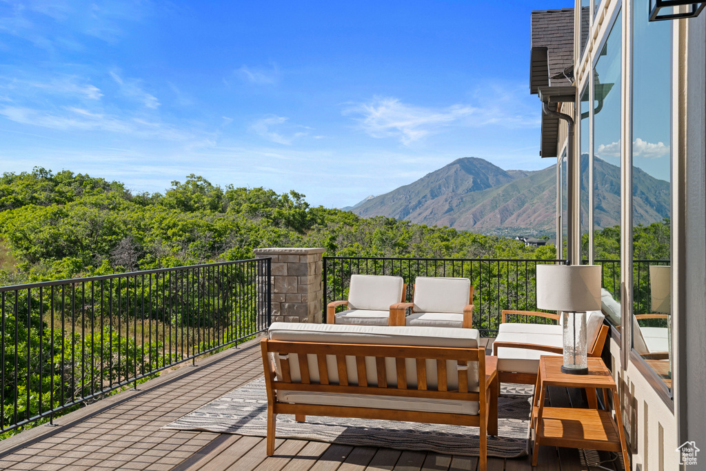 Wooden terrace with a mountain view and an outdoor living space