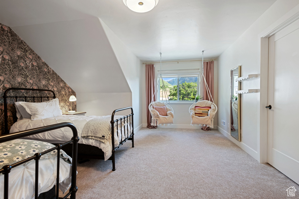 Carpeted bedroom with baseboards