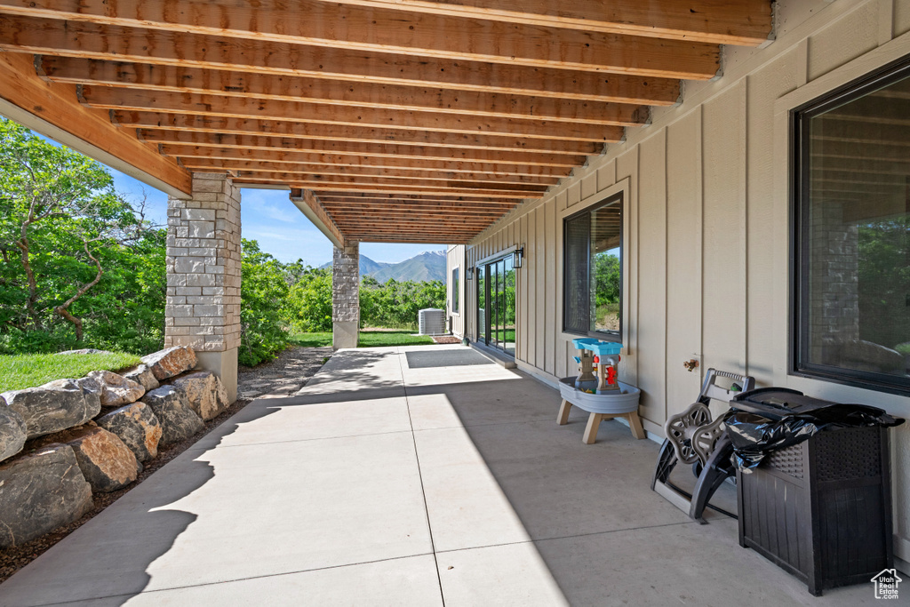 View of patio / terrace with a mountain view