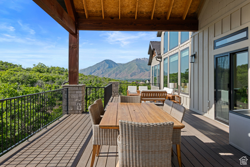 Wooden terrace featuring a mountain view