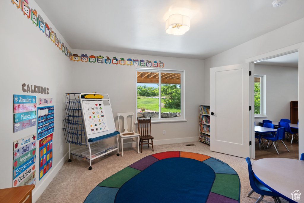 Game room featuring carpet flooring and baseboards