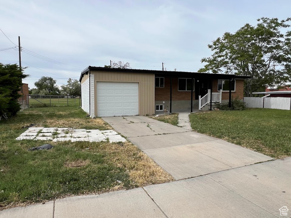 Single story home with an attached garage and driveway