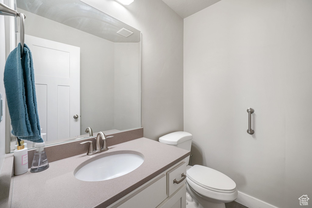 Bathroom with toilet and vanity