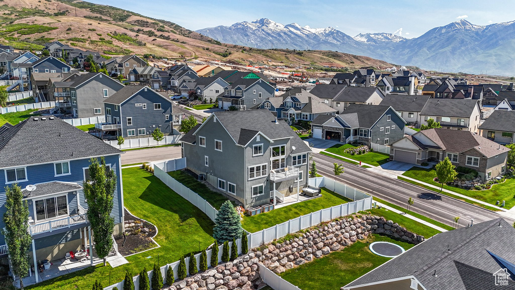 Aerial view of residential area featuring a mountain backdrop