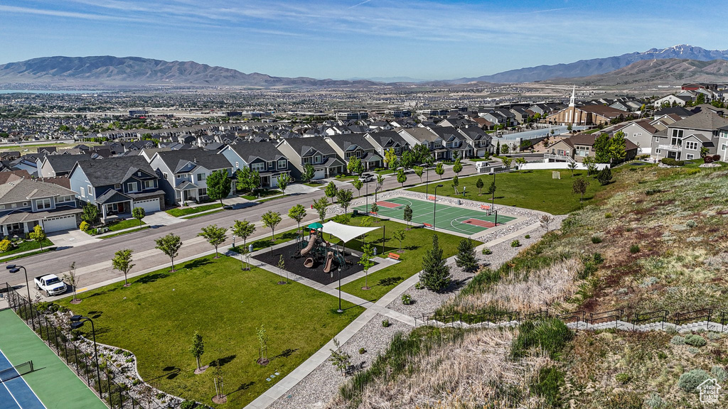 Aerial view of residential area featuring a mountain backdrop